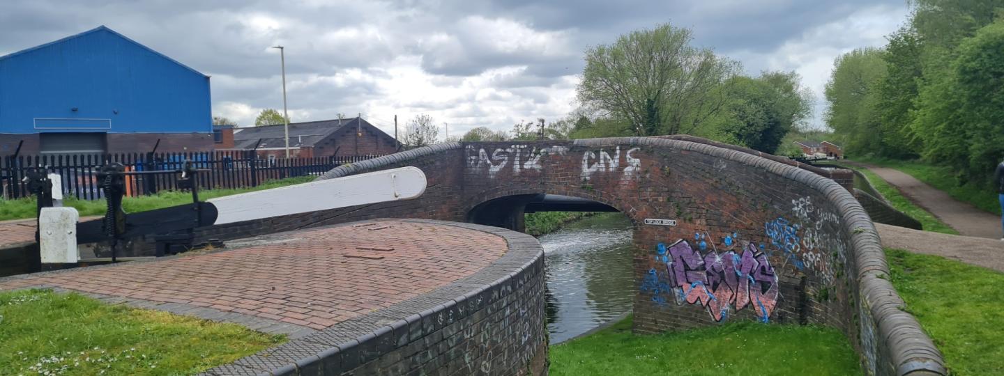 Photograph of the canals in Dudley. A bridge goes over the canal.